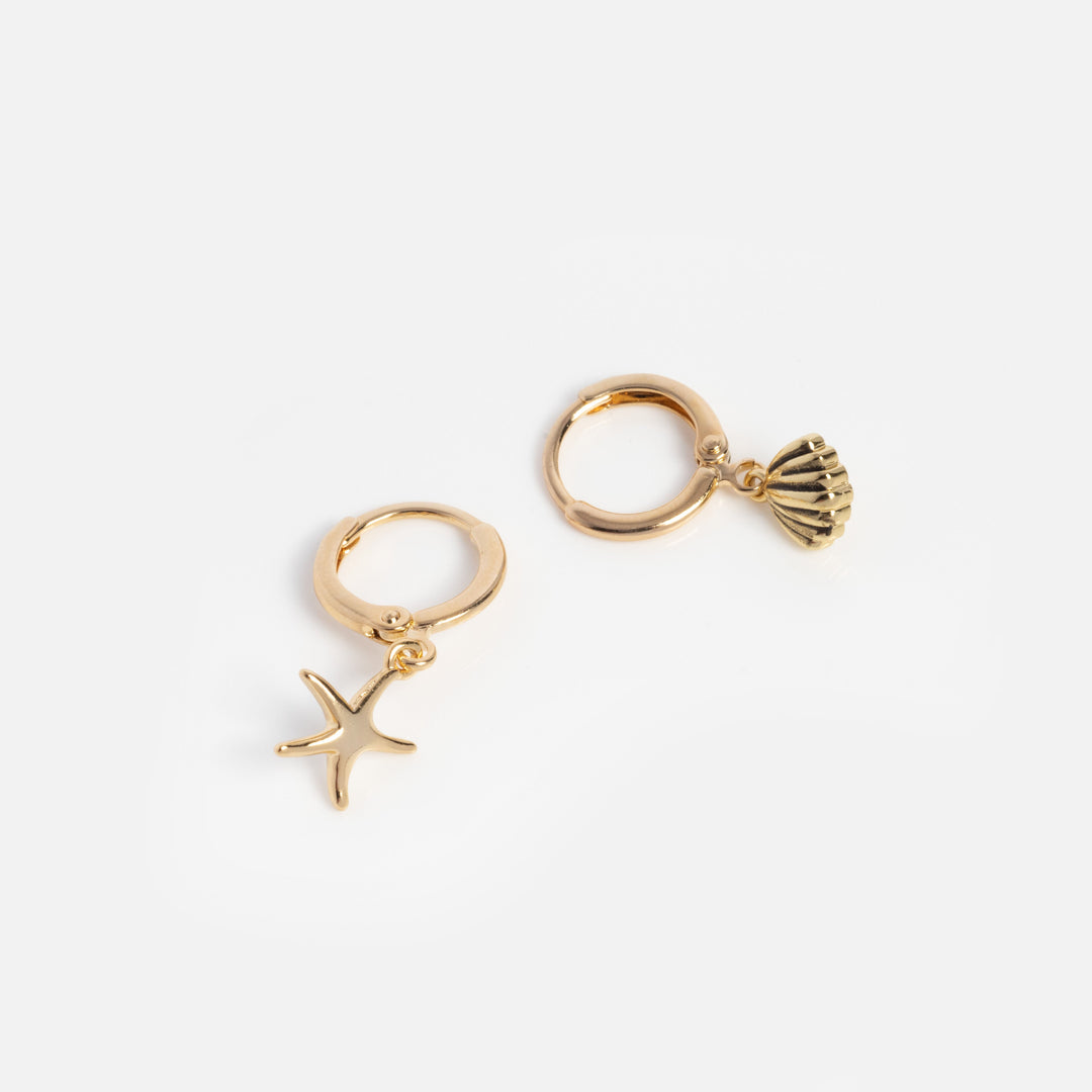 Gold hoop earrings with starfish and shell charms on a white background