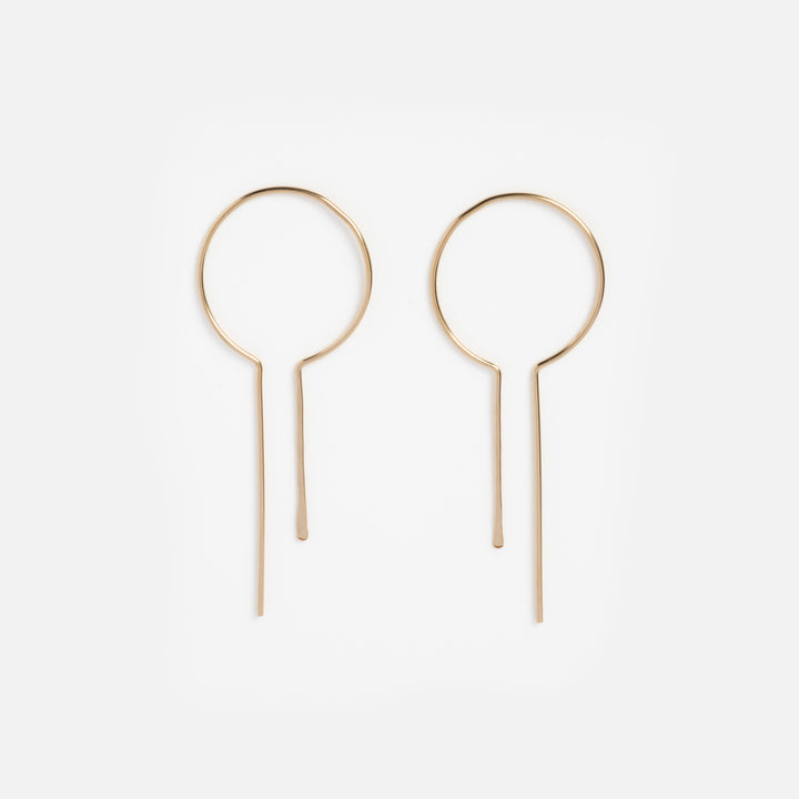 Pair of gold hoop earrings on a white background