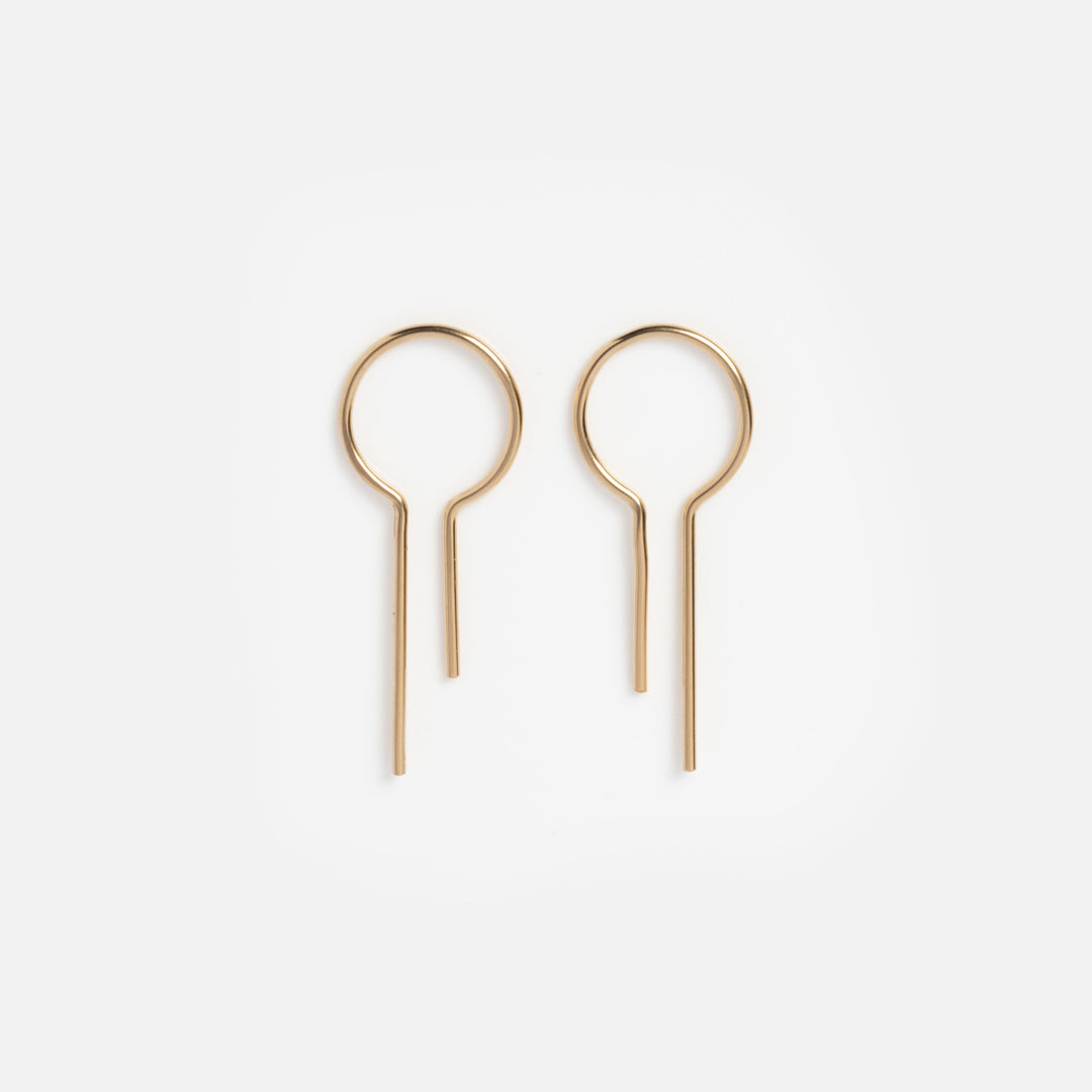 Pair of gold hoop earrings on a white background