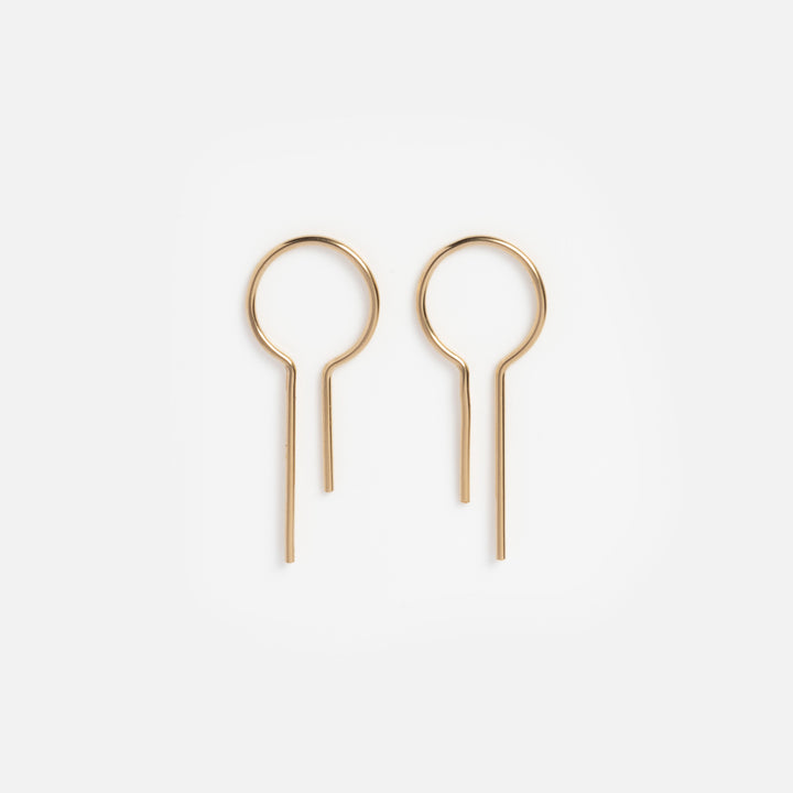 Pair of gold hoop earrings on a white background
