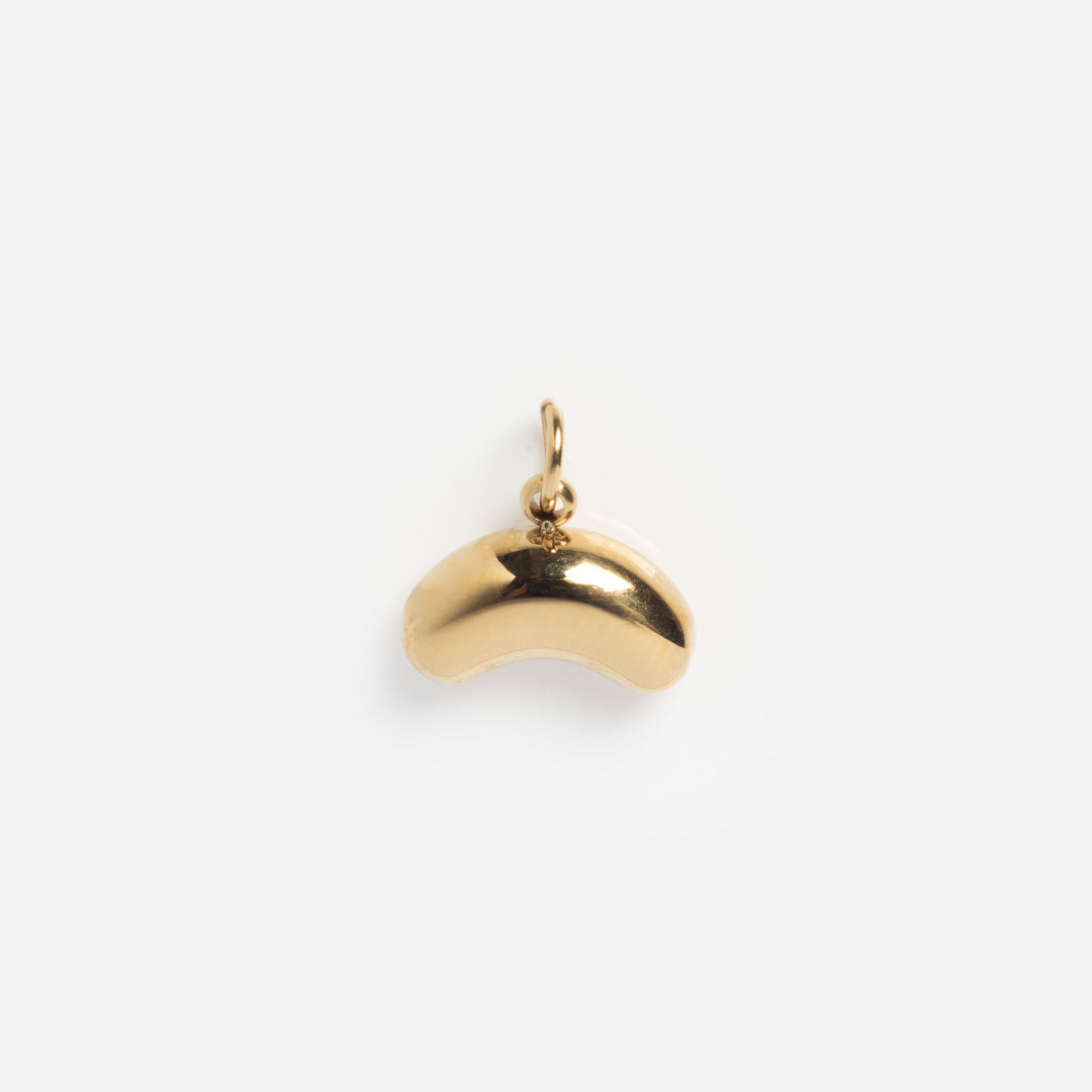 Gold pendant on a white background