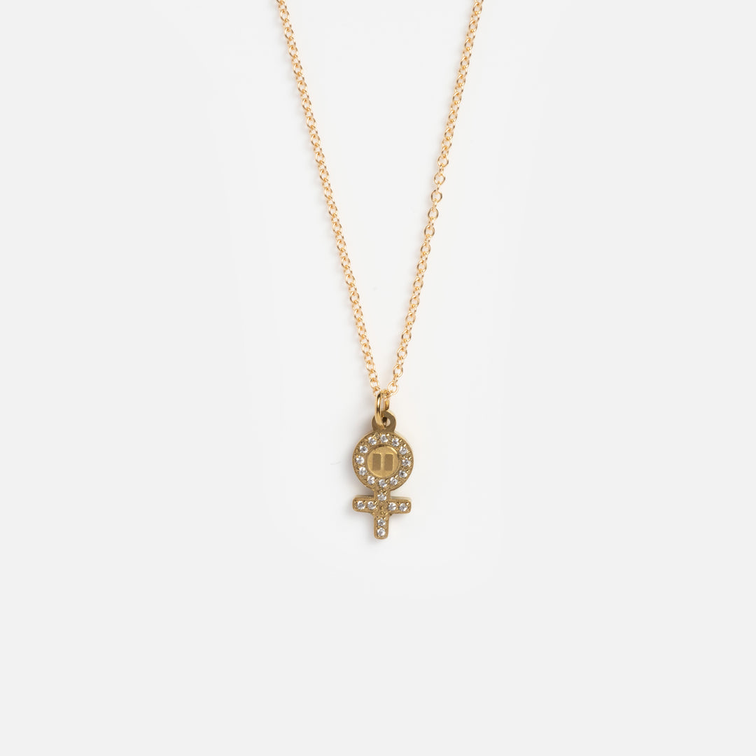 Gold necklace with a pendant on a white background