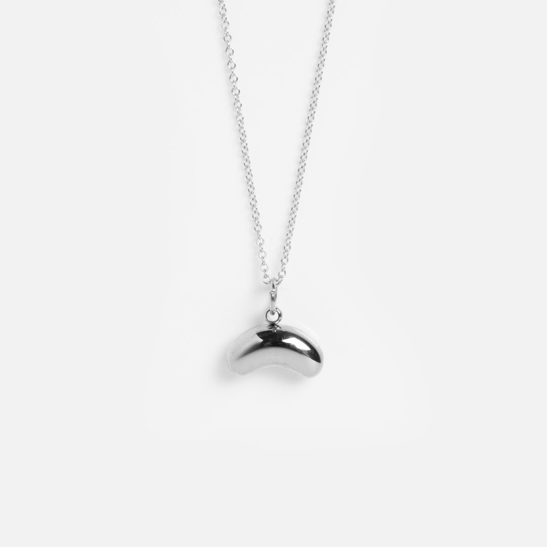Silver necklace with a unique pendant on a white background