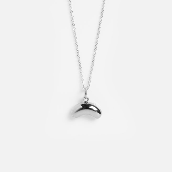 Silver necklace with a unique pendant on a white background