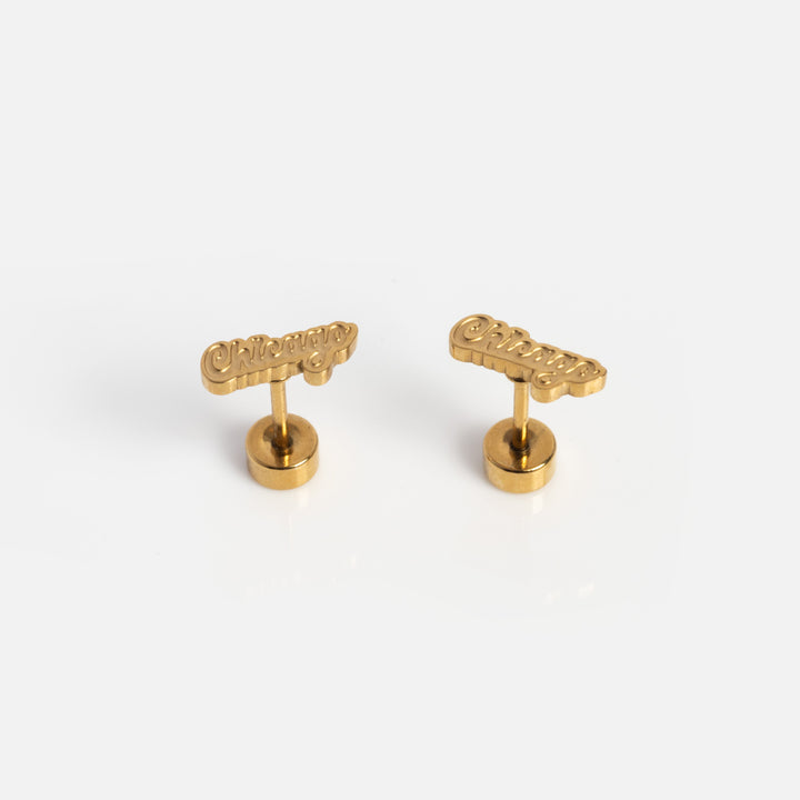 Pair of gold cufflinks on a white background