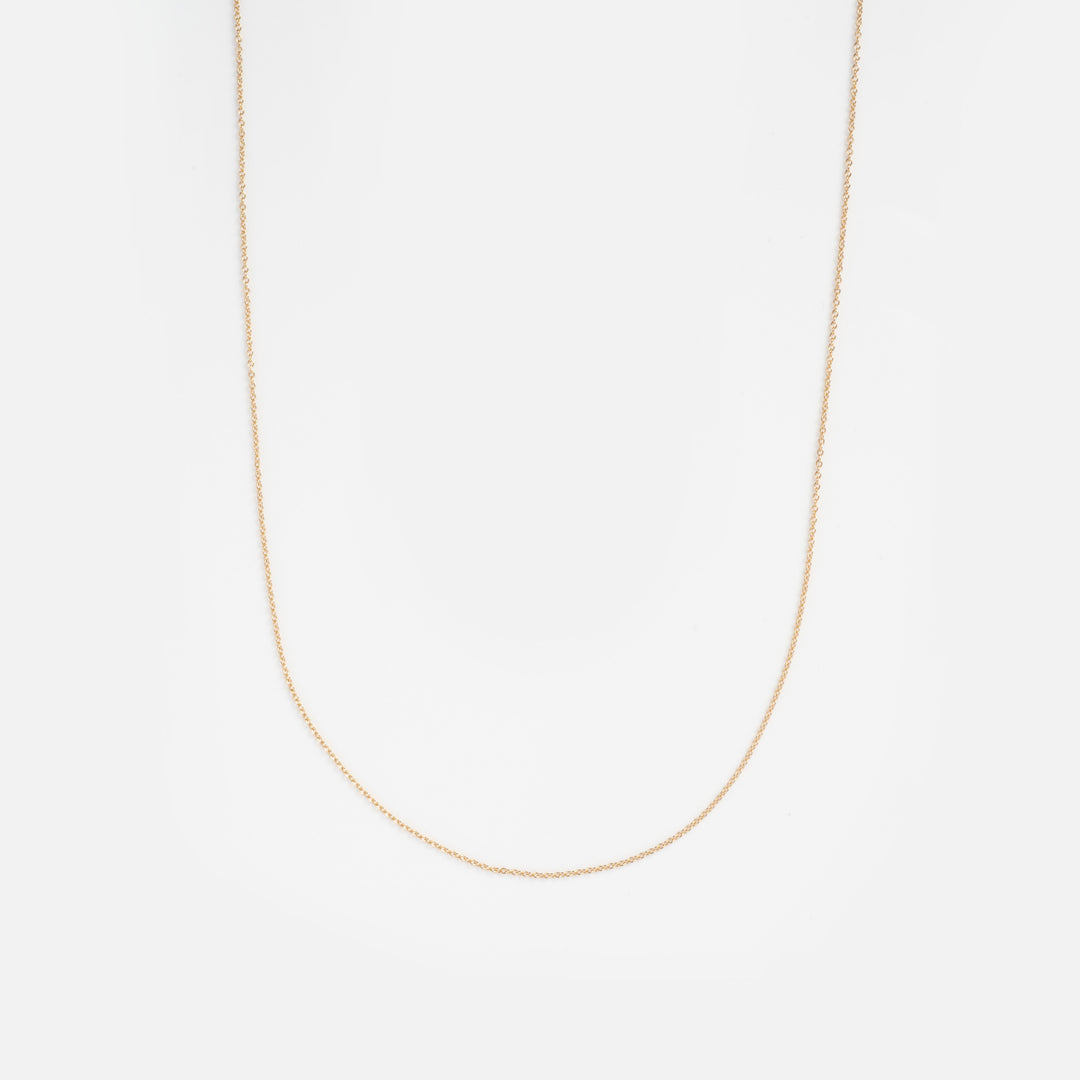 Gold chain necklace on a white background
