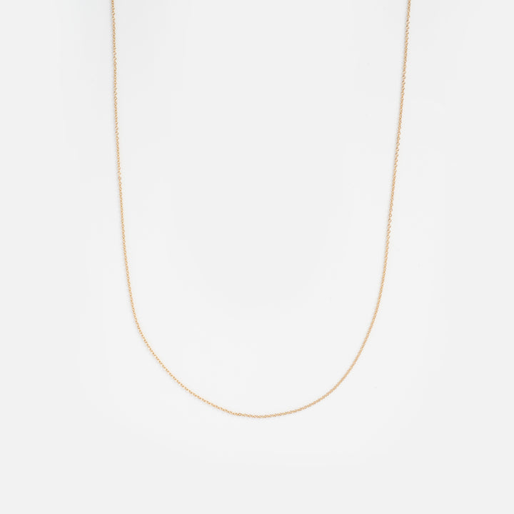 Gold chain necklace on a white background
