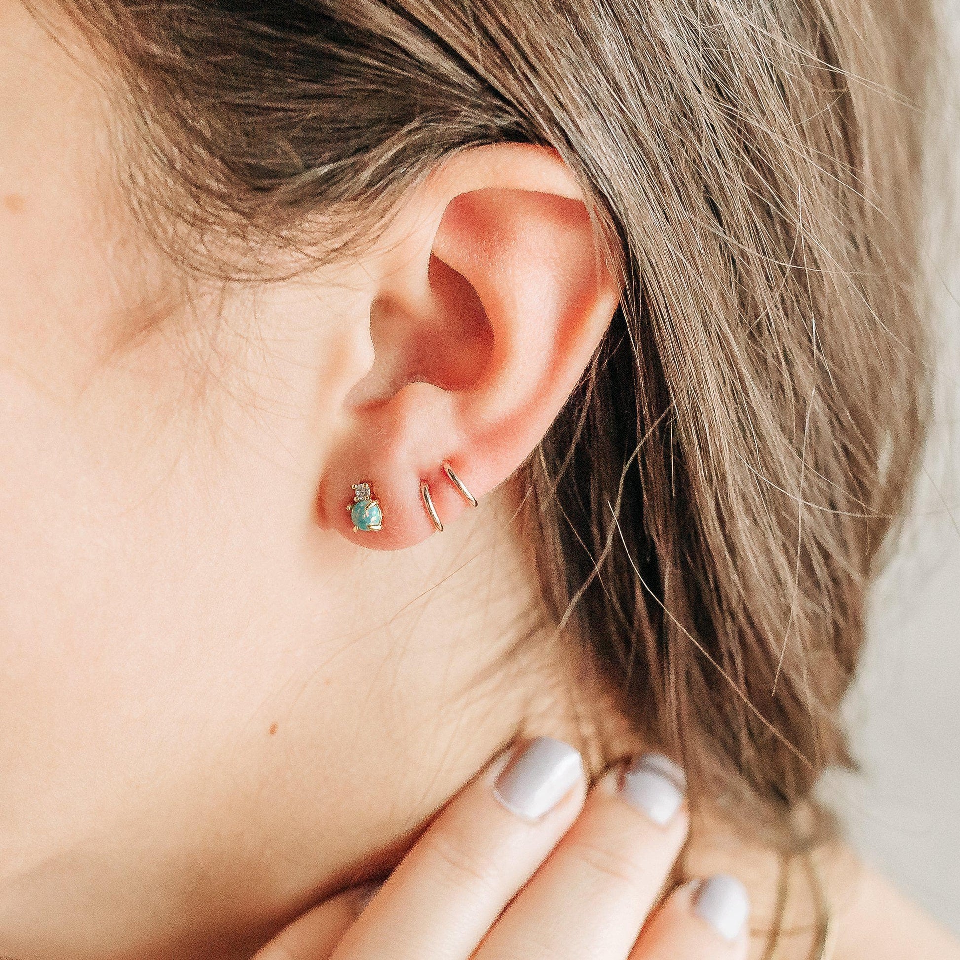 How to put in our Tiny Twist earrings. One earring, two little hoops.